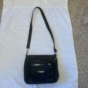 Women’s black shoulder purse. 8 compartments and 2 cell size pockets.